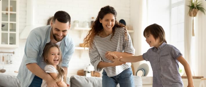 Family laughing and playing together